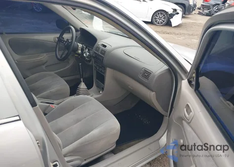 2001 Toyota Corolla Ce z USA, uszkodzony, nr VIN 2T1BR12E01C426405